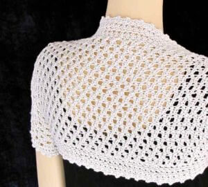 The Liebling Shrug is crocheted with both Tunisian and linked stitches.