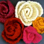 5 slip stitch roses of different colors and petal shapes