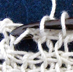 Extreme close up of a good quality crochet thread makes it look old and hairy.