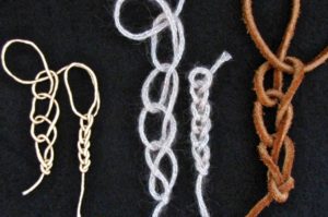 Hand chaining (finger crocheting) loosely and tightly in 3 different fibers: sain cord, wool tube yarn, suede lacing.