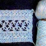 Double-stranded Lovelace swatch: sport weight Lotus and lace weight glittery mohair.