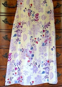 Full length silk skirt with a floral print. Lavender and cream colored background with rich gem colors in the foreground of the print.