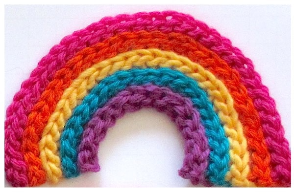 A smoothly curving slip stitch rib rainbow thanks to invisible increases!
