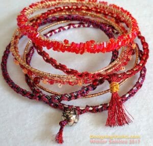 Stack of sparkling crocheted Solstice Bangles.