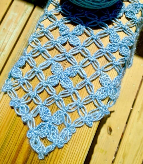 The first corner of a hanky-hem love knot mesh vest in spring sunshine.