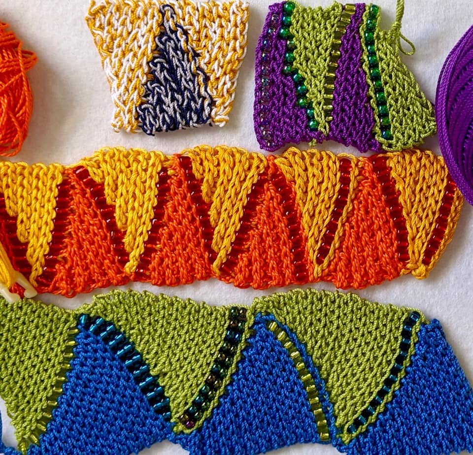 Four swatches of two-color flat bead crochet