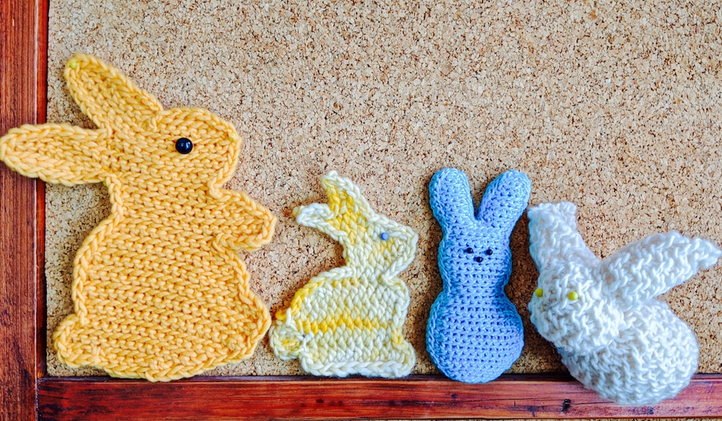 2 flat crocheted bunnies (sihouette), 2 stuffed ones, in different slip stitch crochet textures.
