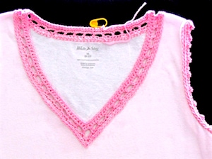 Customing a tank top with crochet to give it a well defined v-neck and picot-trimmed armholes.