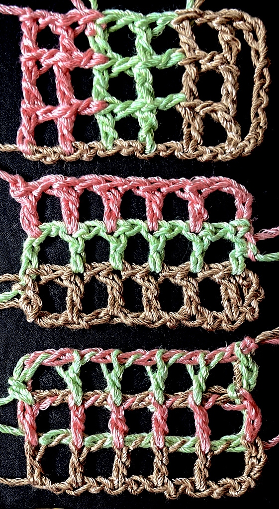 Seemingly simple filet crochet mesh with three colors ending up in very different places.