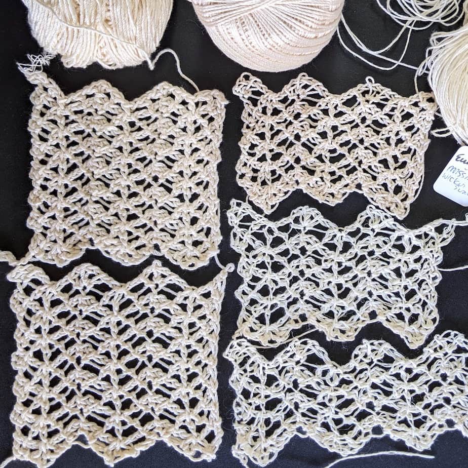 Five lace swatches arranged flat, each a bit different.