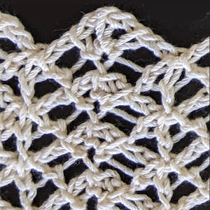 Close up of twisted stitches in Lotus yarn